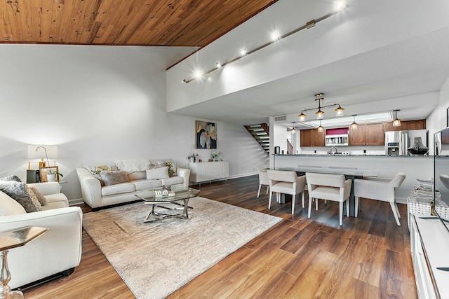 living room with wood ceiling and dark hardwood / wood-style flooring