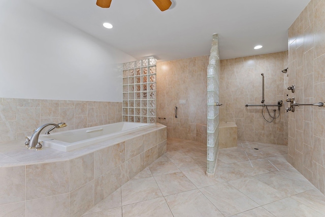 bathroom with tile patterned flooring and separate shower and tub