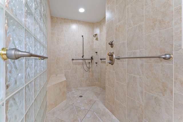 bathroom with tiled shower