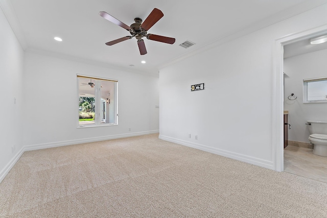 carpeted empty room featuring crown molding and ceiling fan