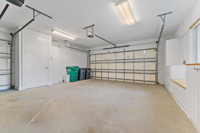 garage featuring a garage door opener