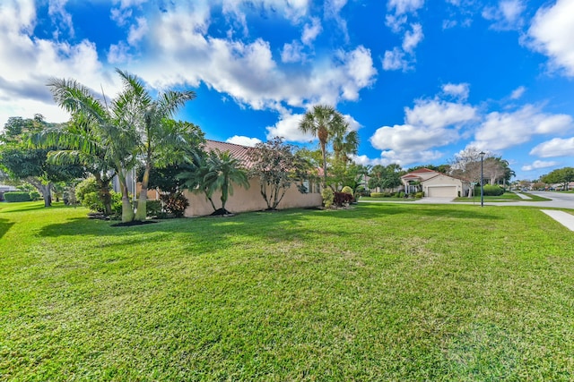 view of yard with a garage