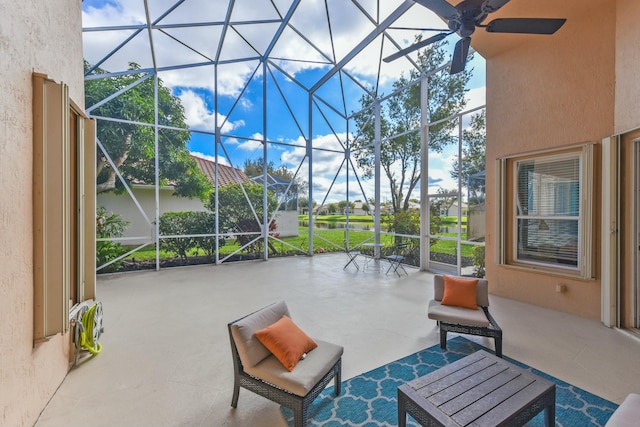 view of patio / terrace with glass enclosure and ceiling fan