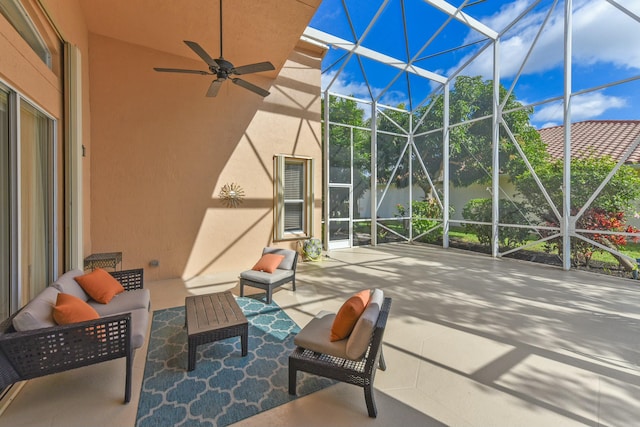 view of patio featuring a lanai, ceiling fan, and an outdoor living space