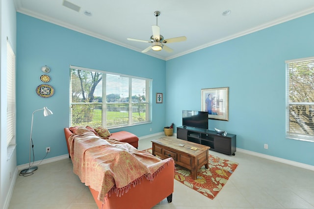 tiled living room with ceiling fan and crown molding