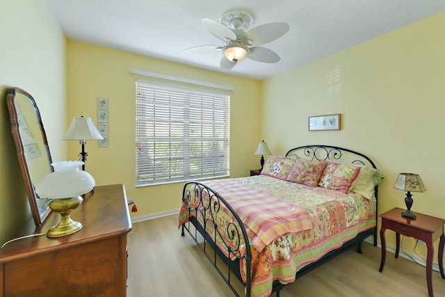 bedroom featuring light hardwood / wood-style flooring and ceiling fan