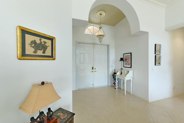 foyer featuring ornamental molding