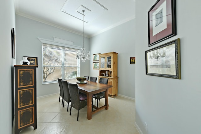 tiled dining space with a notable chandelier and crown molding