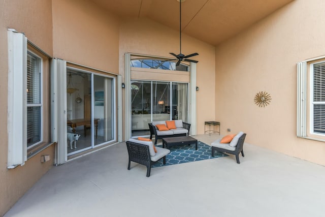 view of patio with an outdoor living space and ceiling fan