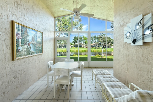 sunroom / solarium with ceiling fan and lofted ceiling