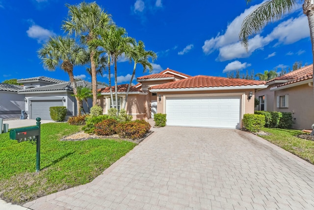 mediterranean / spanish house featuring a garage