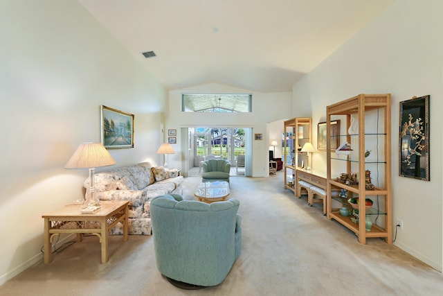 living room featuring carpet floors and high vaulted ceiling