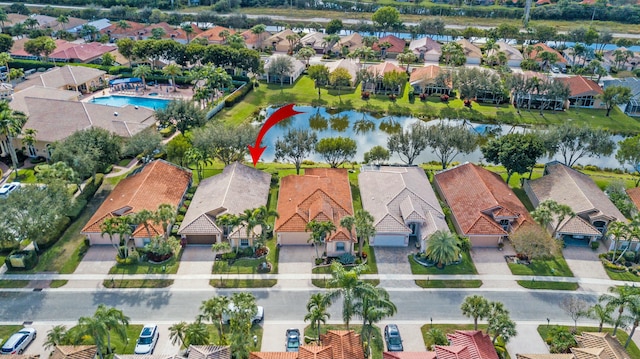 birds eye view of property featuring a water view