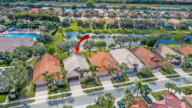 birds eye view of property featuring a water view