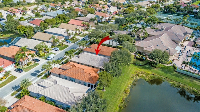 birds eye view of property featuring a water view