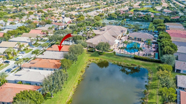 birds eye view of property with a water view