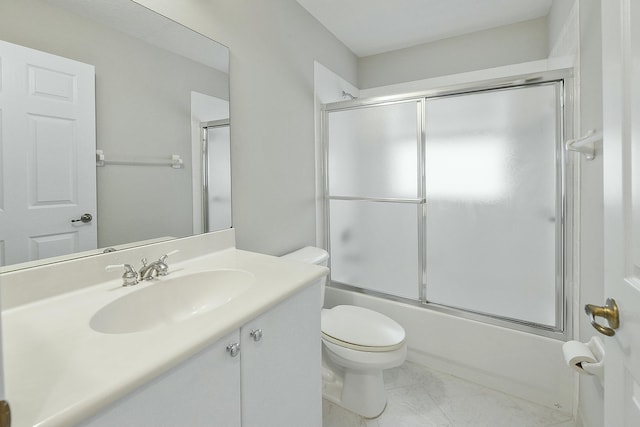 full bathroom with toilet, vanity, and bath / shower combo with glass door