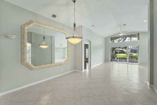 spare room with ceiling fan and high vaulted ceiling