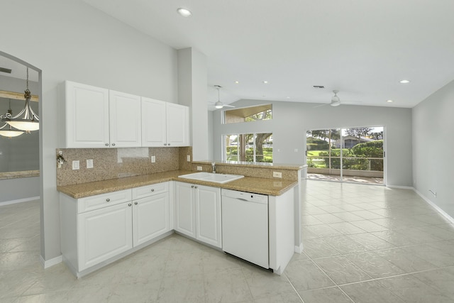 kitchen featuring kitchen peninsula, dishwasher, white cabinets, and sink