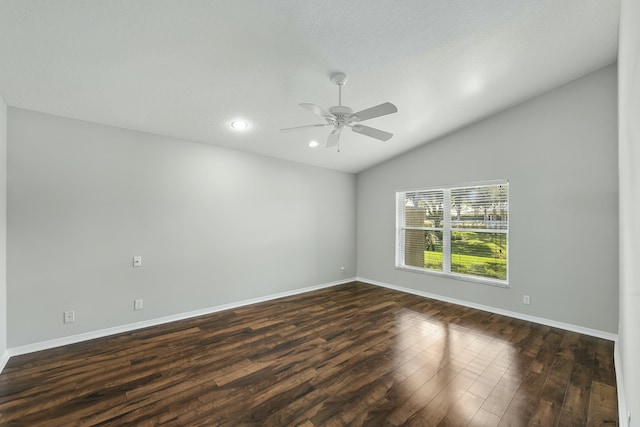 unfurnished room featuring lofted ceiling, dark wood-type flooring, and ceiling fan