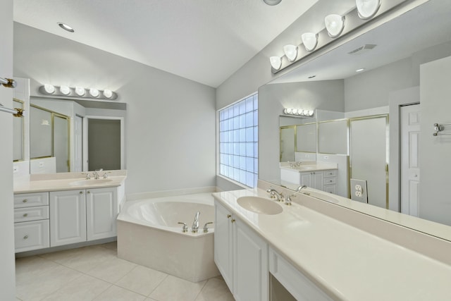 bathroom with tile patterned flooring, plus walk in shower, and vanity