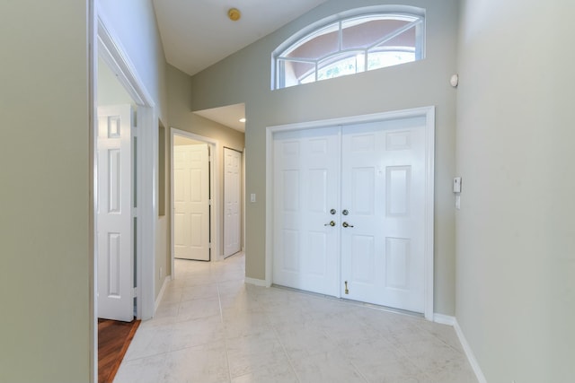 entrance foyer featuring lofted ceiling