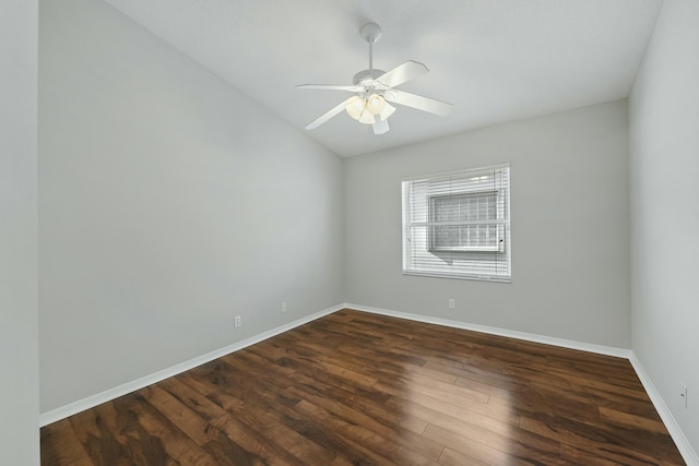 empty room with ceiling fan and dark wood-type flooring