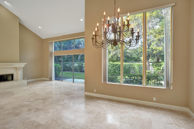 unfurnished living room featuring a fireplace and a notable chandelier