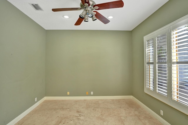 spare room with ceiling fan