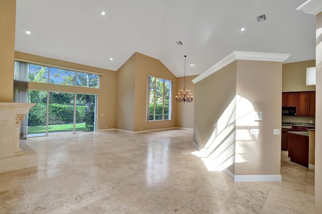 unfurnished living room featuring a notable chandelier, ornamental molding, and high vaulted ceiling