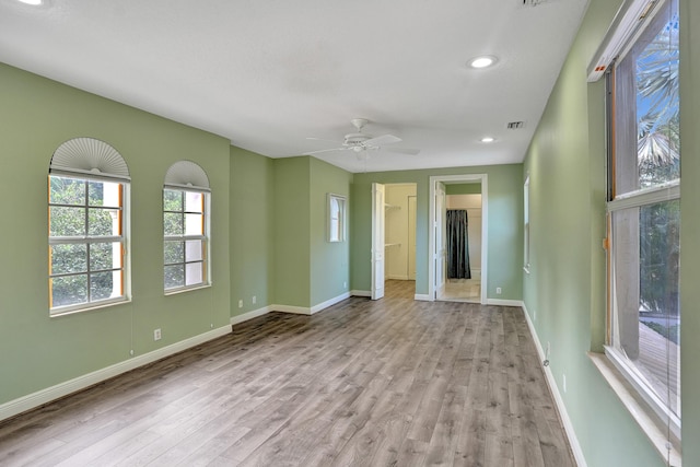 unfurnished room with light hardwood / wood-style flooring and ceiling fan