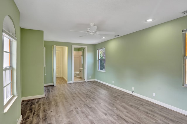 unfurnished room featuring ceiling fan and light wood-type flooring