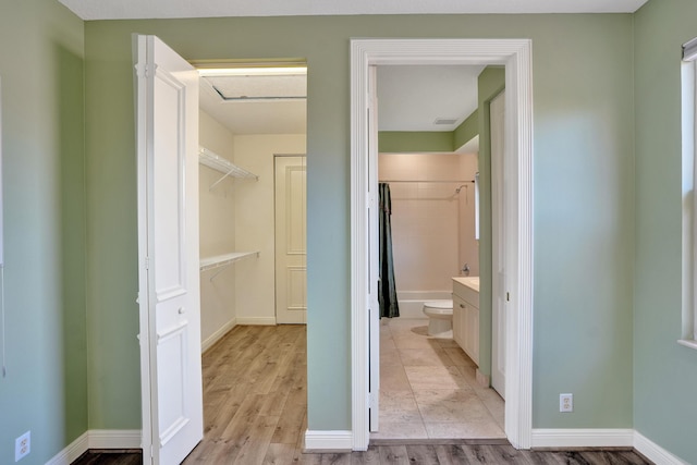 full bathroom featuring shower / bath combination with curtain, vanity, toilet, and hardwood / wood-style floors