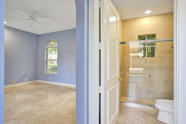 bathroom with toilet and ceiling fan