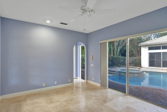 empty room featuring ceiling fan