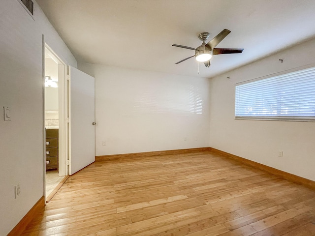 unfurnished room featuring light hardwood / wood-style floors and ceiling fan