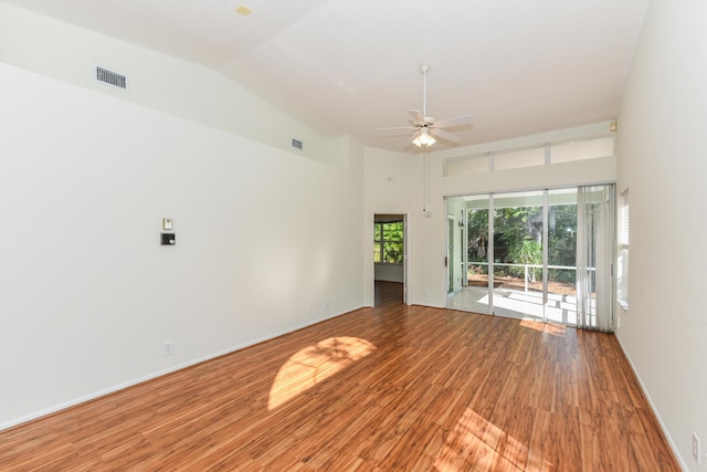 empty room with hardwood / wood-style flooring, vaulted ceiling, and ceiling fan