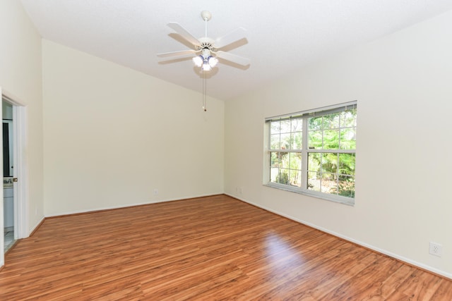 empty room featuring wood-type flooring and ceiling fan