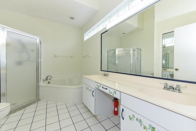 full bathroom with tile patterned floors, vanity, toilet, and plus walk in shower