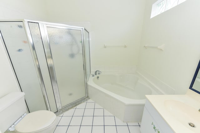 full bathroom featuring tile patterned floors, vanity, shower with separate bathtub, and toilet