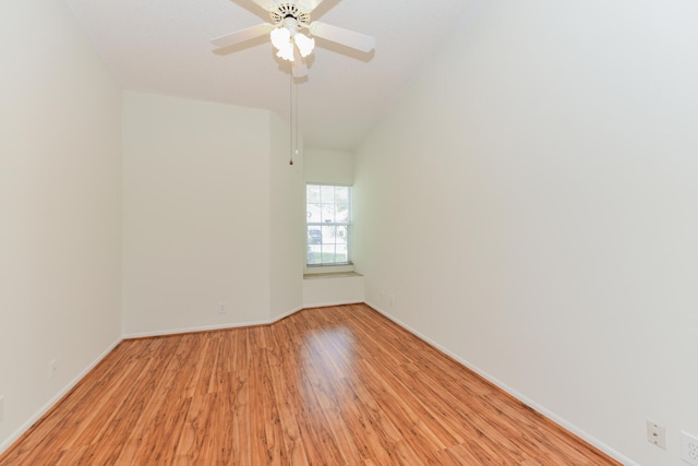 empty room with light hardwood / wood-style flooring and ceiling fan