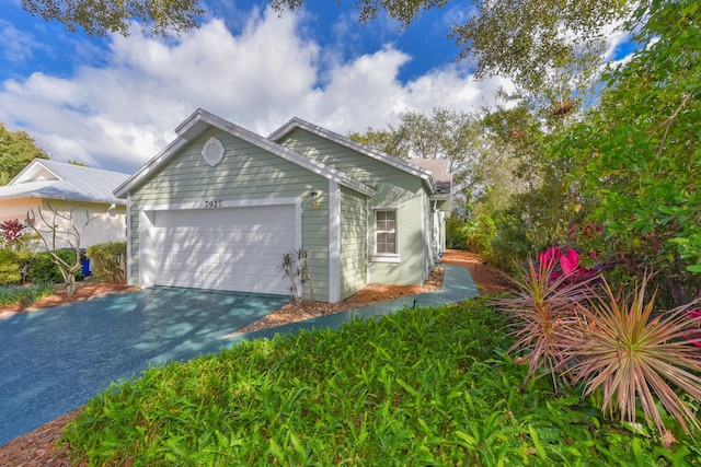 view of side of home with a garage