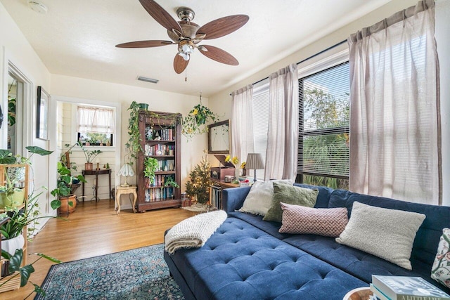 interior space with hardwood / wood-style floors and ceiling fan