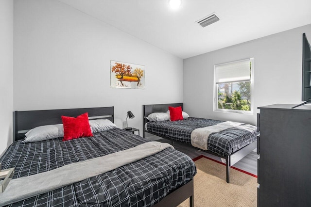 bedroom with vaulted ceiling