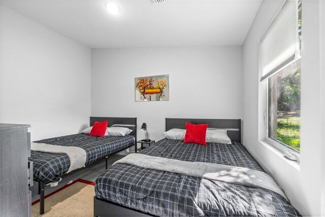 bedroom featuring dark hardwood / wood-style flooring