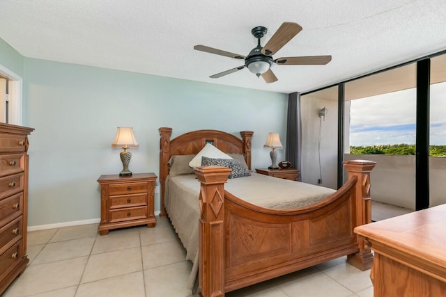 bedroom with access to exterior, a textured ceiling, and ceiling fan