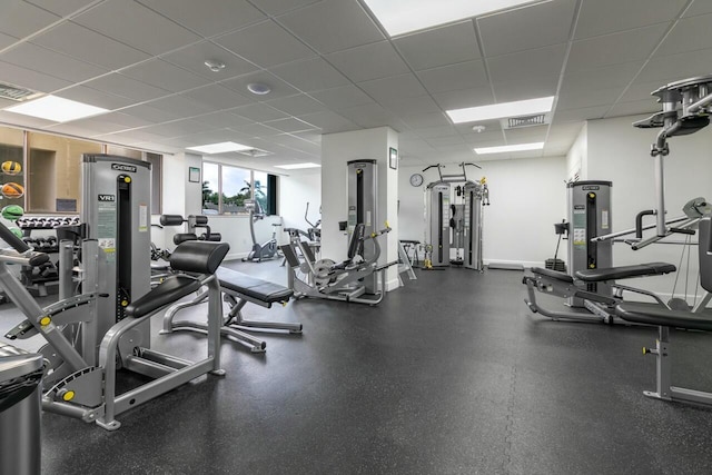 exercise room featuring a paneled ceiling