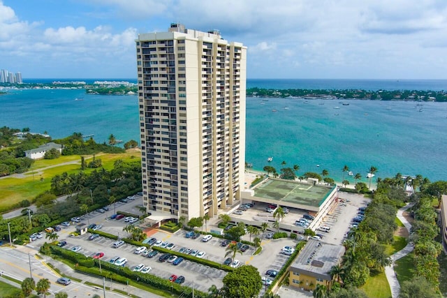 birds eye view of property with a water view