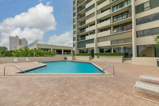 view of pool featuring a patio