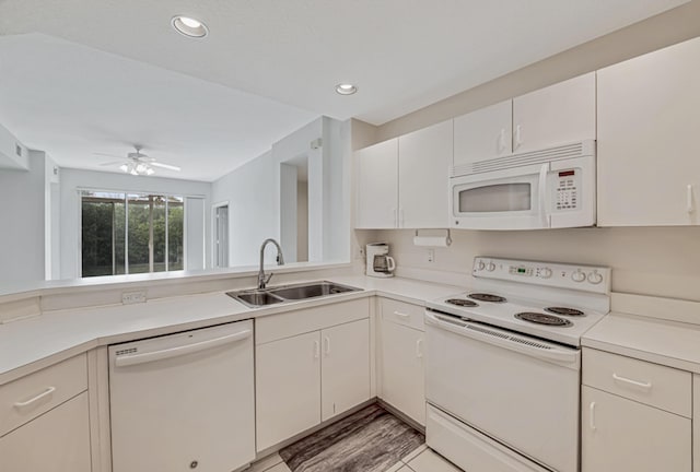 kitchen featuring sink, white cabinets, ceiling fan, white appliances, and light hardwood / wood-style flooring